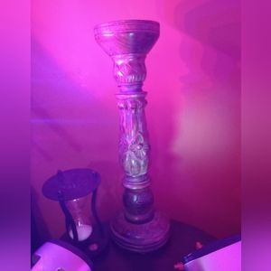 This is a marble wood antique candle holder